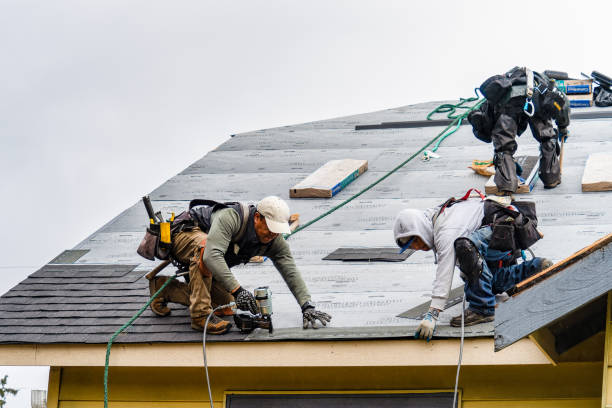 Professional Storm Damage Roof Repair technician working in West Islip, NY